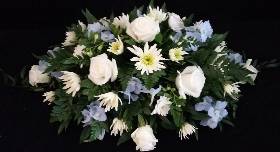 White Roses with blue and white mixed flowers